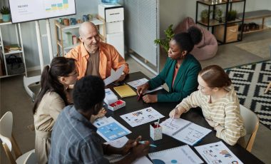 diverse-business-team-meeting-at-table-2025-03-05-23-06-37-utc (1)