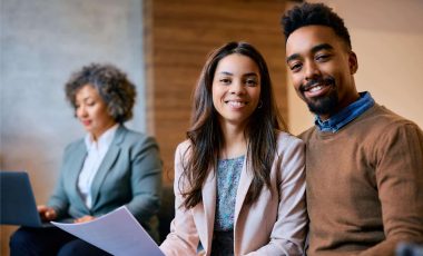 happy-black-couple-on-a-meeting-with-financial-adv-2024-12-13-17-10-44-utc (1)