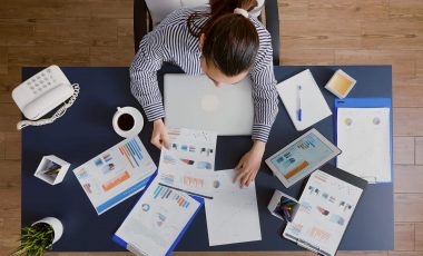 top-view-of-accountant-woman-typing-marketing-stra-2025-02-20-07-38-51-utc (1)