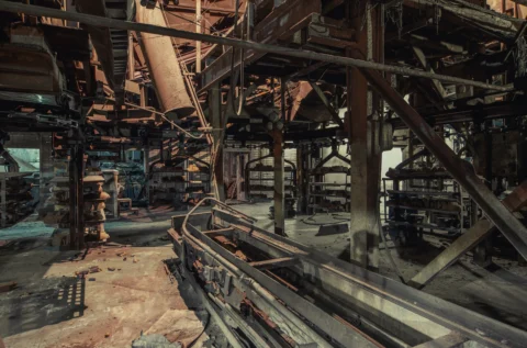 Faded lean manufacturing visual board on an empty assembly line floor