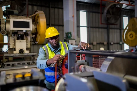 manufacturing foreman implementing 5s Shine by maintaining machine