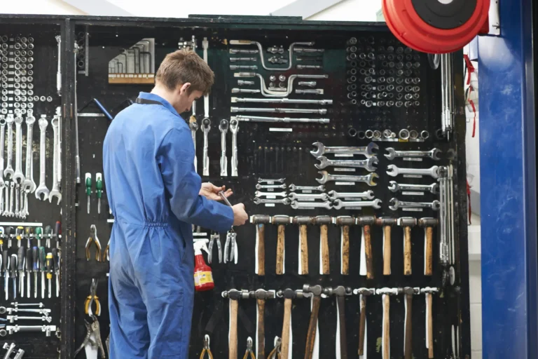 mechanic organizing tools as part of 5s methodology in lean manufacturing implementation